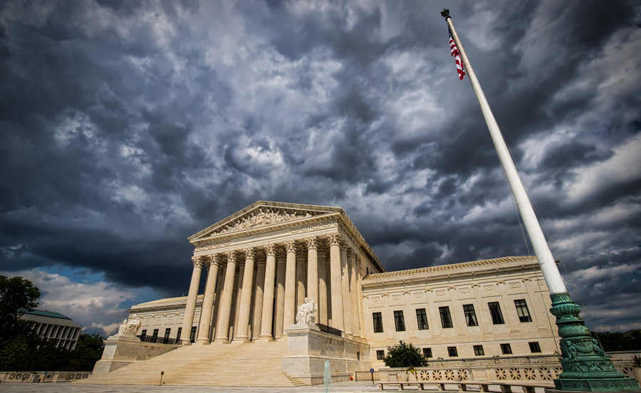 Photo of the Supreme Court building under storm clouds